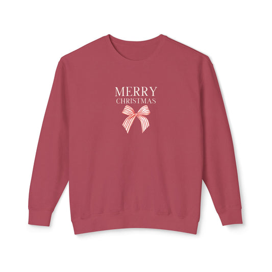 A dusty rose crewneck sweatshirt featuring a 'MERRY CHRISTMAS' text graphic and a striped bow illustration on the chest, displayed against a clean white background.