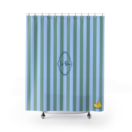Shower curtain with blue and green striped pattern and 'Le Bain' logo on a white background