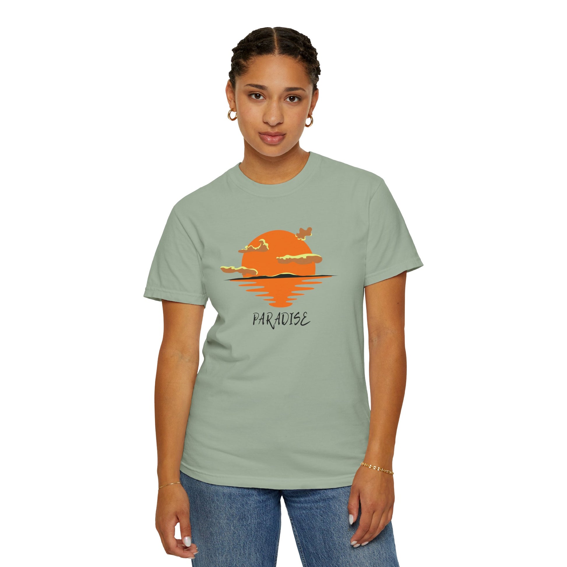 Person wearing a light green t-shirt with a sunset design and 'Paradise' text on a white background