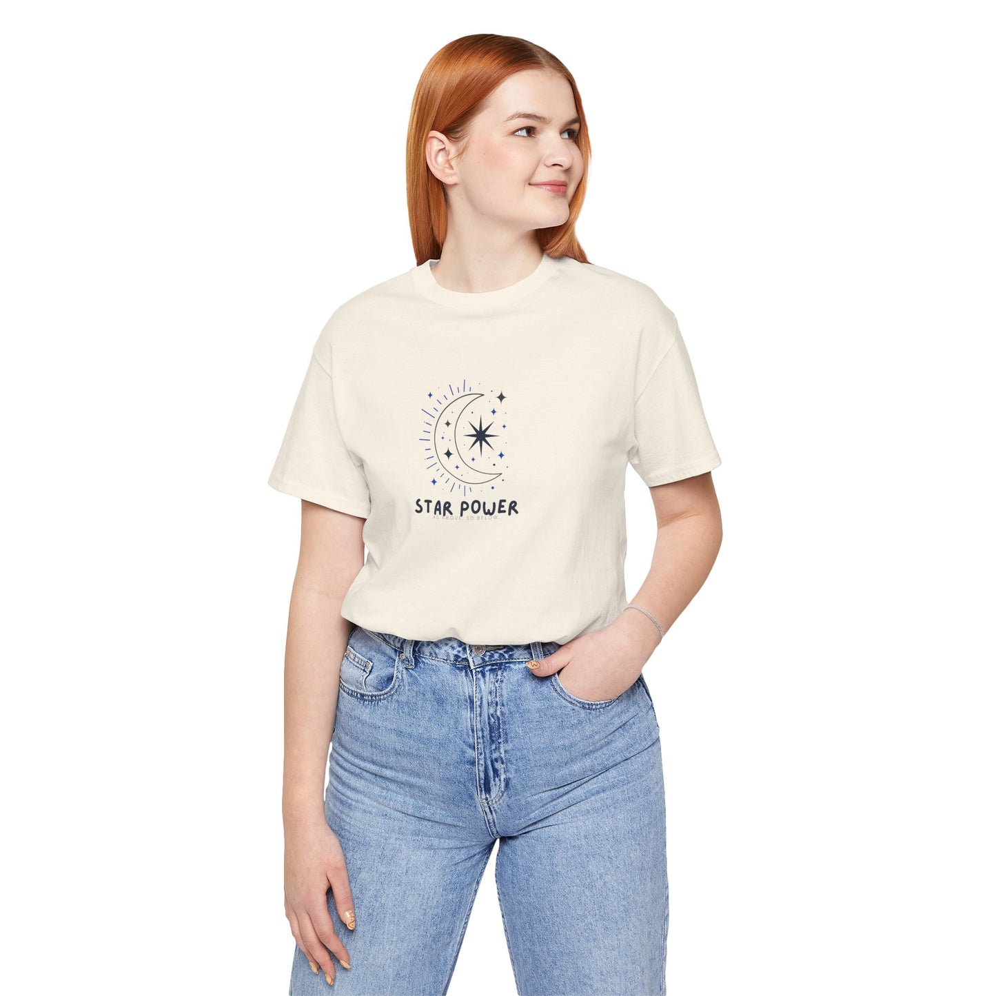 Person wearing a white t-shirt with 'STAR POWER' text and blue jeans on a white background