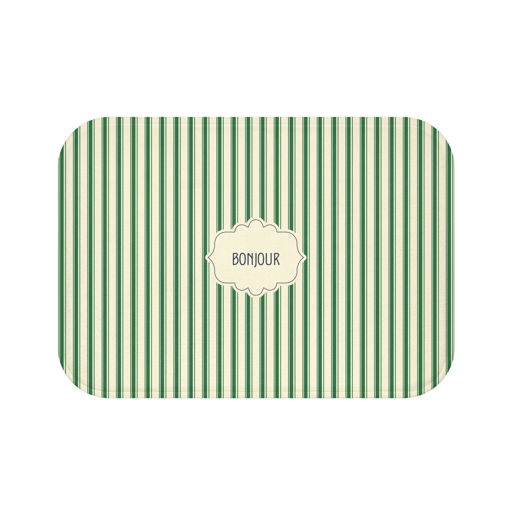 A luxe bath mat with rounded corners, featuring a green and white vertical stripe pattern and a central cream-colored label that reads 'BONJOUR'.