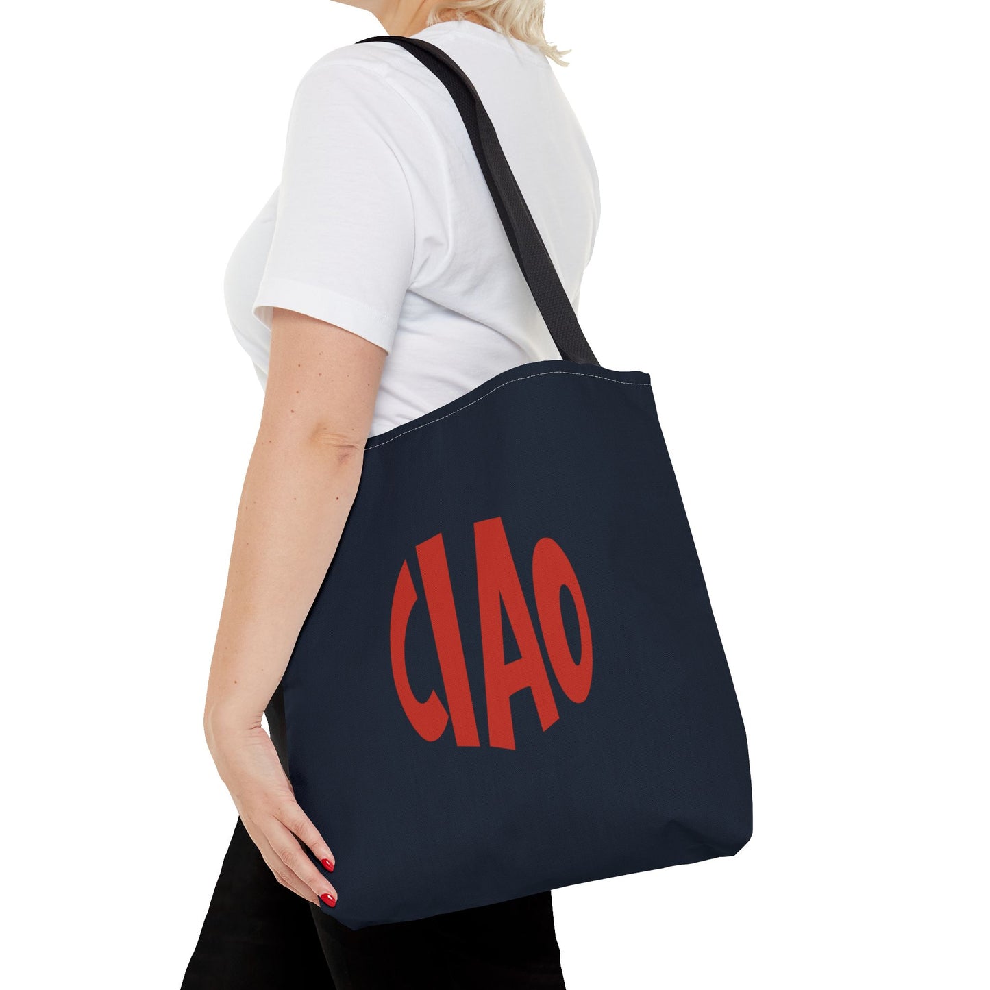Person holding a navy tote bag with 'CIAO' in red text on a white background