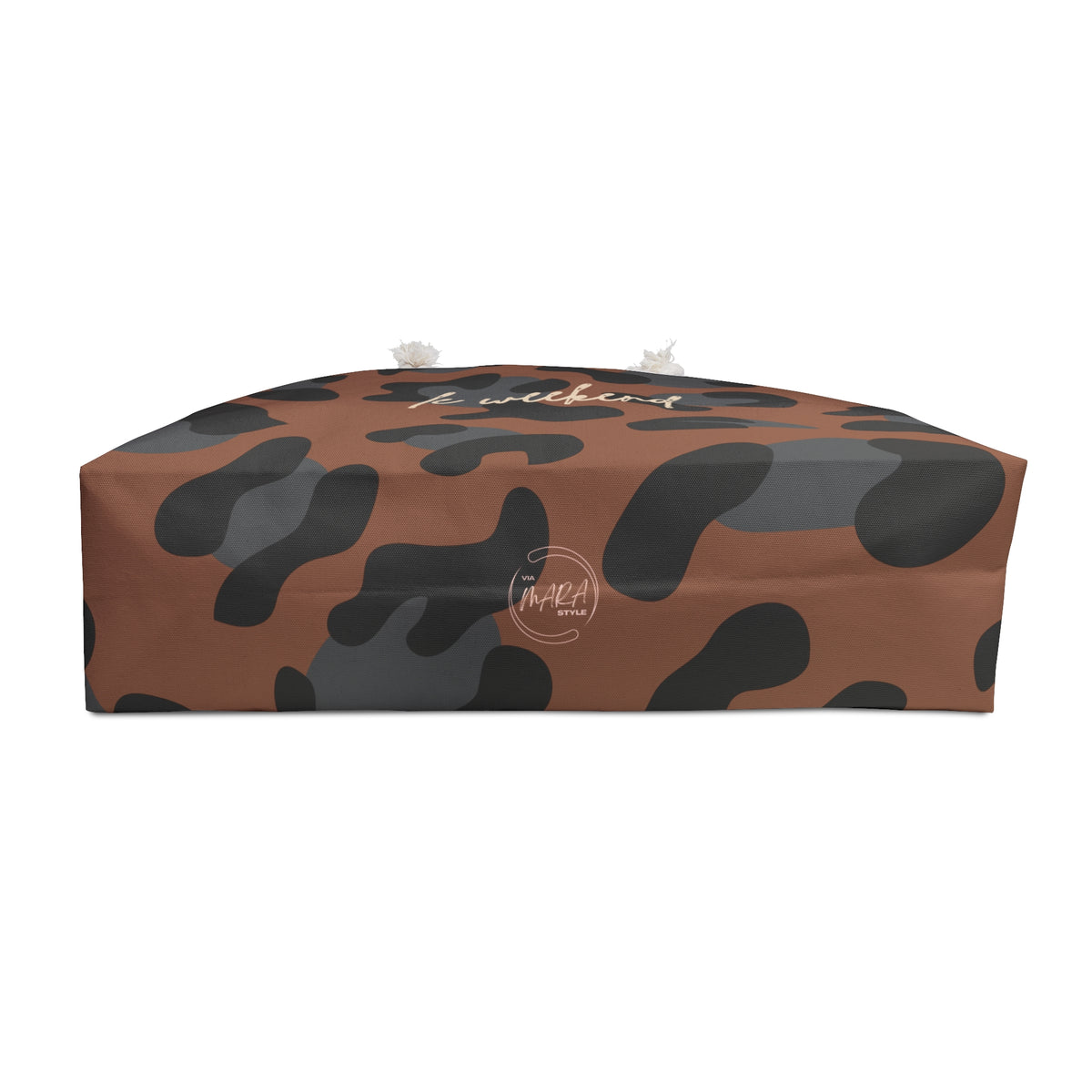 A rectangular floor cushion or ottoman with a brown and dark gray camouflage pattern, featuring a white script logo on the top surface, set against a plain white background.