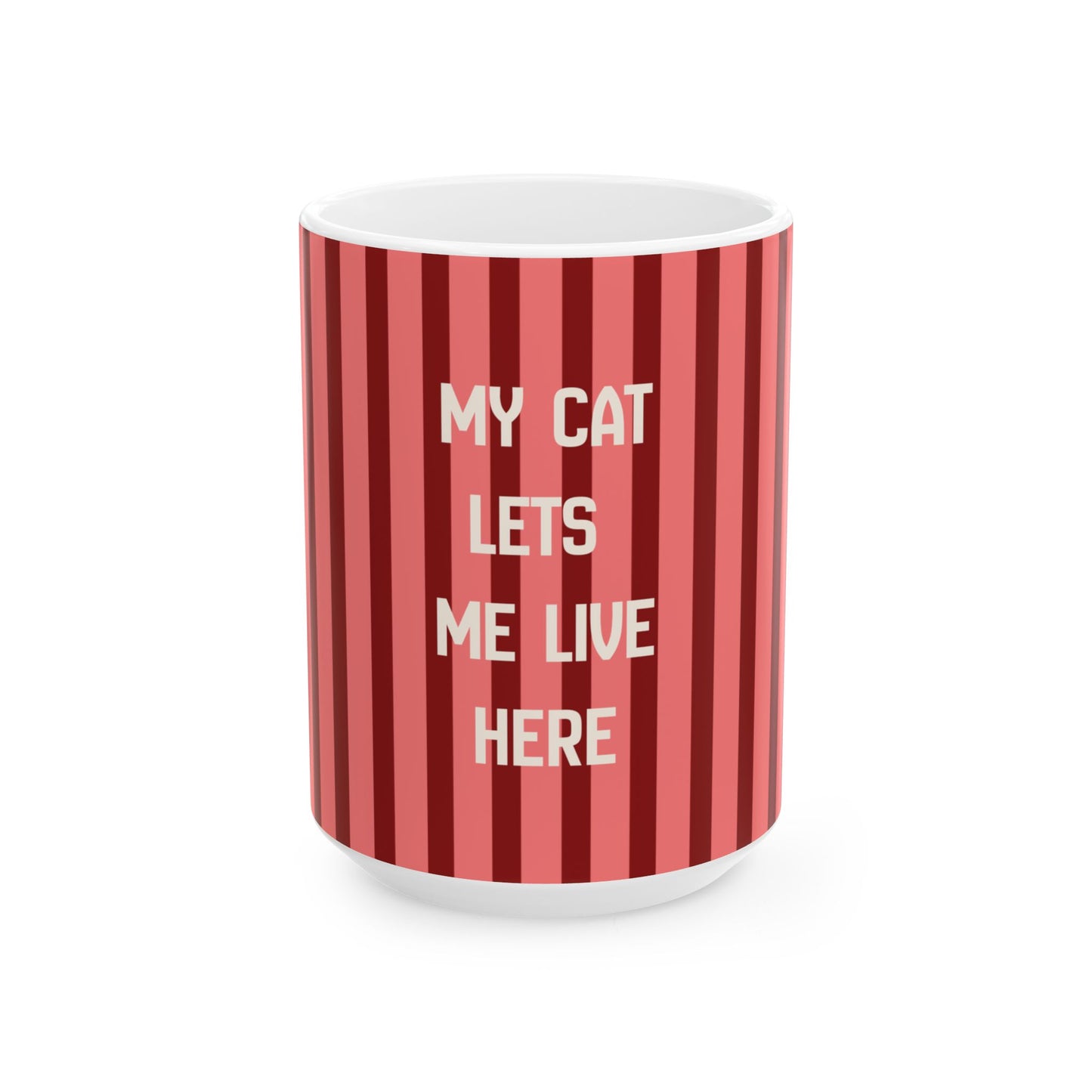 A white ceramic mug featuring a red and pink vertical striped pattern with the text 'MY CAT LETS ME LIVE HERE' printed in white capital letters, set against a plain white background.