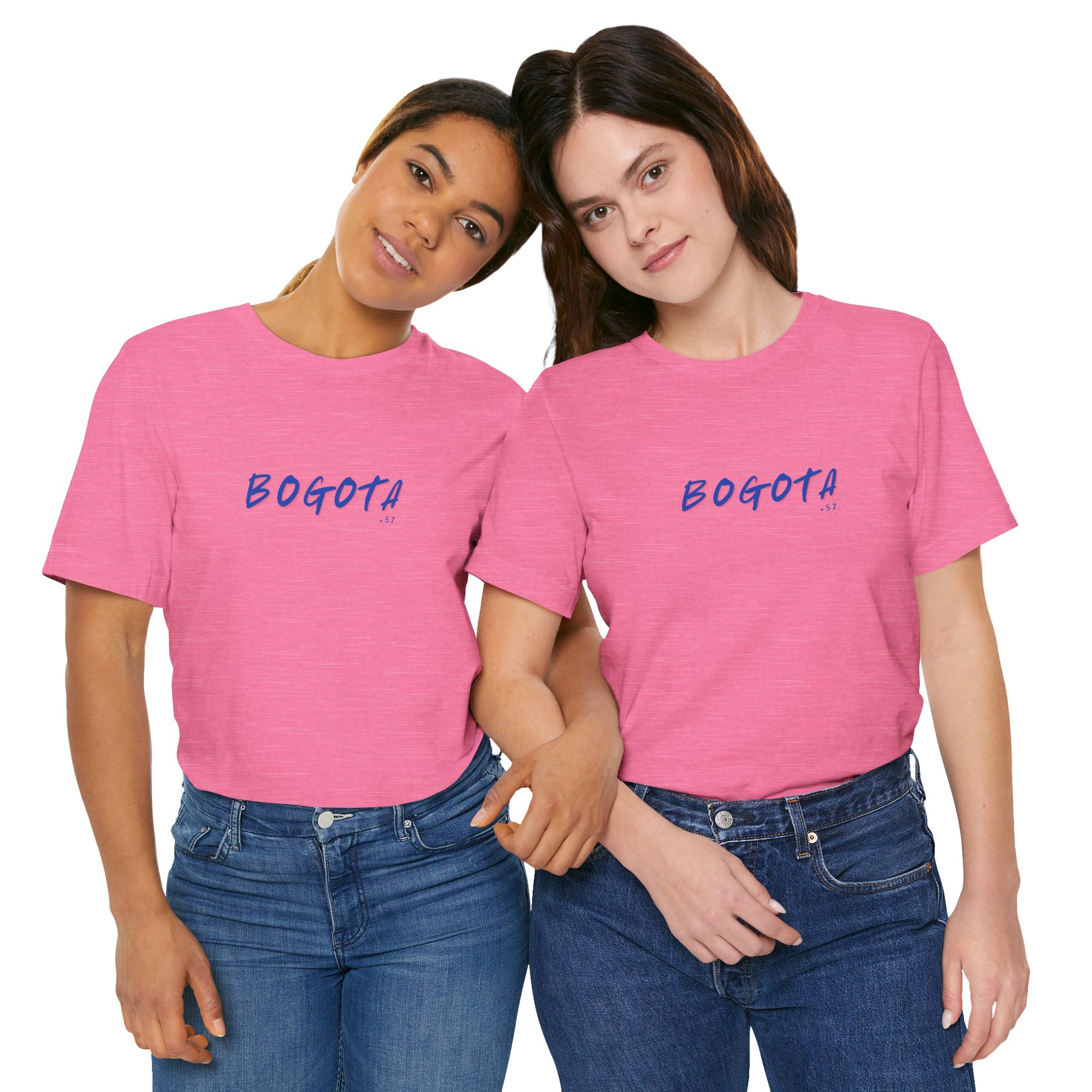 Two people wearing pink t-shirts with 'BOGOTA' printed on them against a white background.