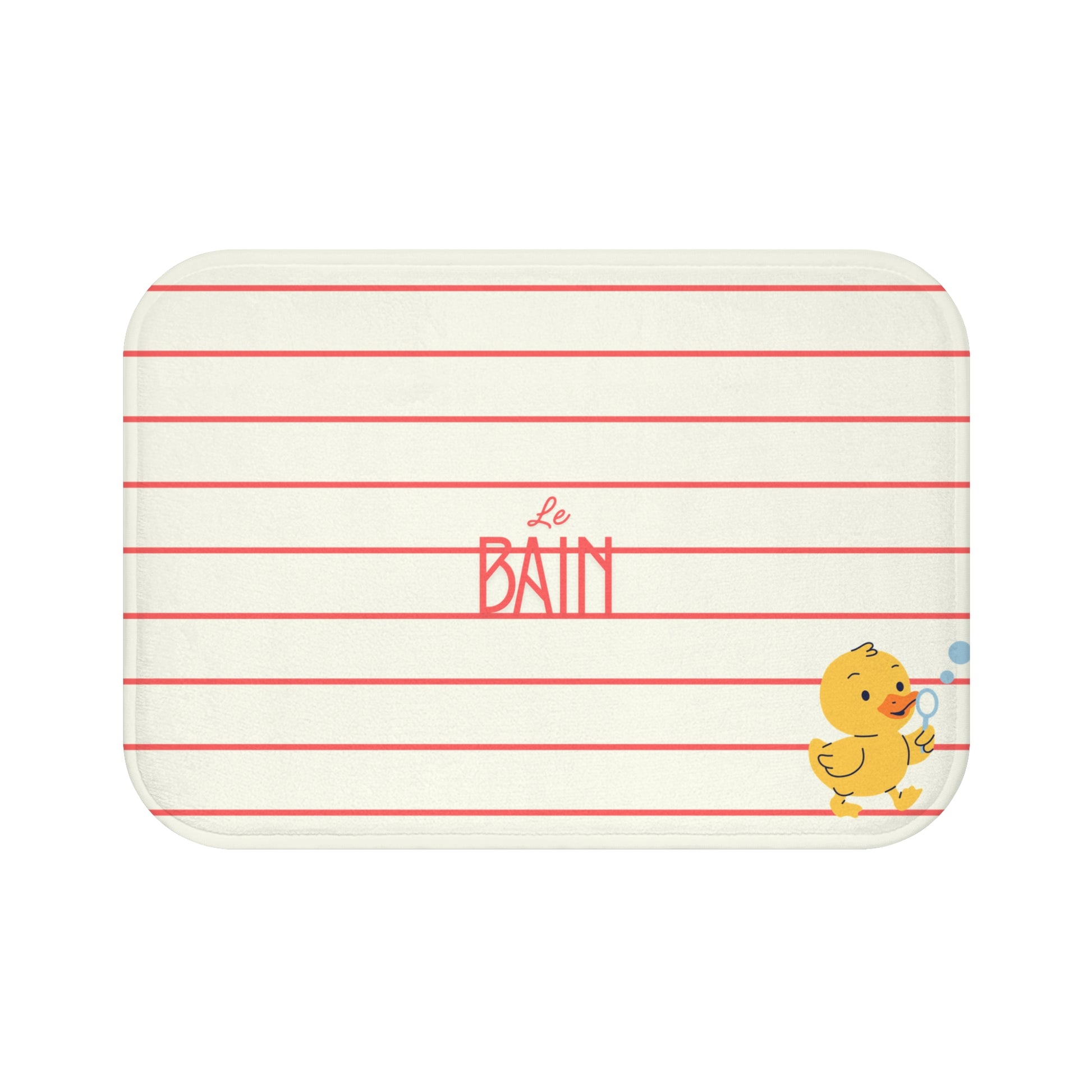 A rectangular baby bath mat with rounded corners, featuring a cream background with thin red horizontal stripes, the French word 'Le BAIN' in coral pink in the center, and a small yellow cartoon duck holding a blue bubble in the bottom right corner.