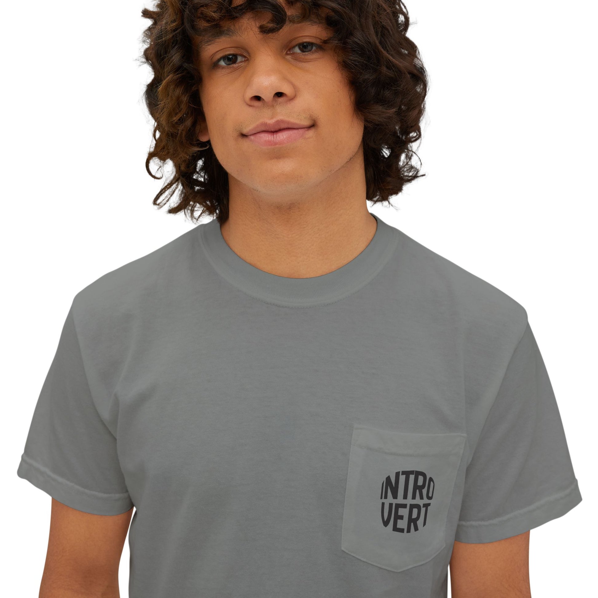 Person wearing a gray t-shirt with 'INTROVERT' on a plain background