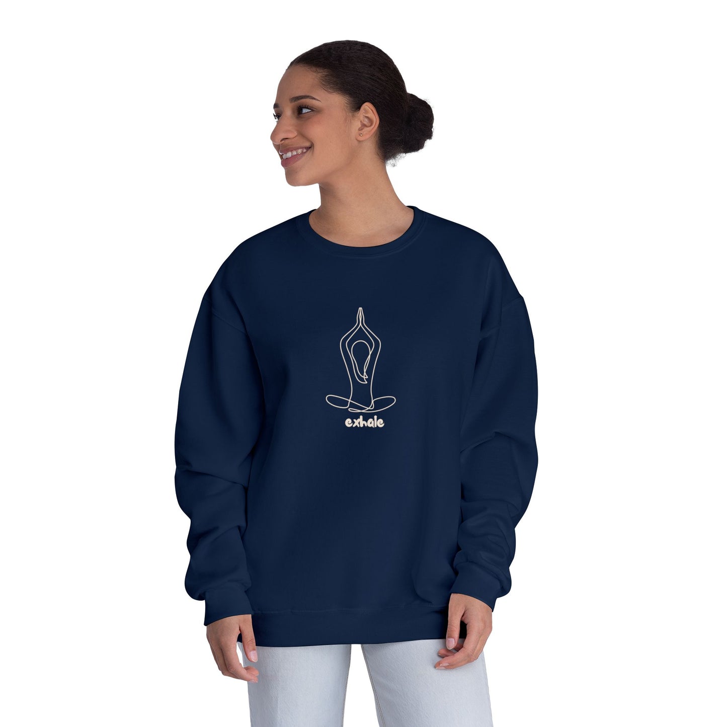 Woman wearing a navy blue sweatshirt with a white yoga pose design on a white background
