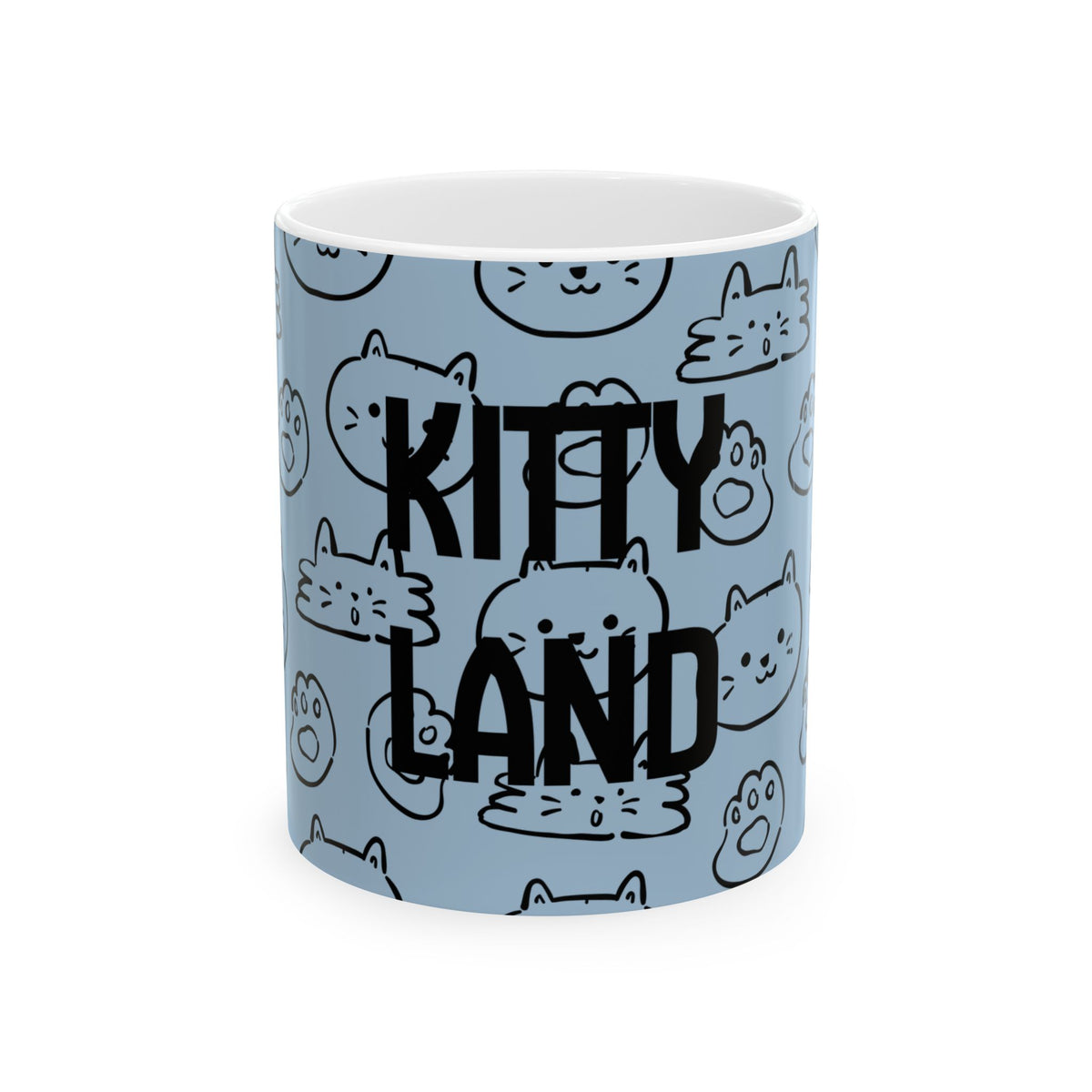 A light blue ceramic mug with a white interior, featuring a repeating pattern of black-and-white cartoon cat faces and the words 'KITTY LAND' in large black letters across the front.