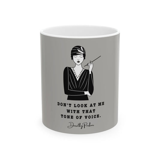 Gray mug with a black and white illustration of a woman and a quote on a white background