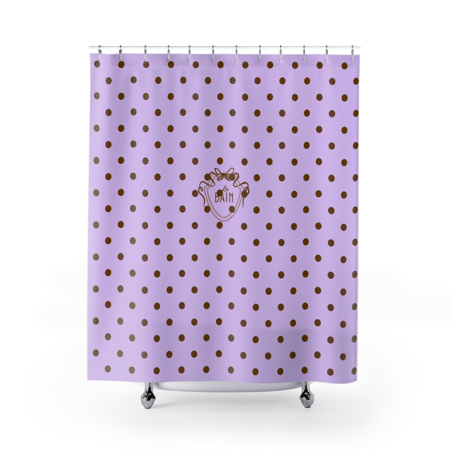 Purple shower curtain with gold polka dots and a logo on a white background