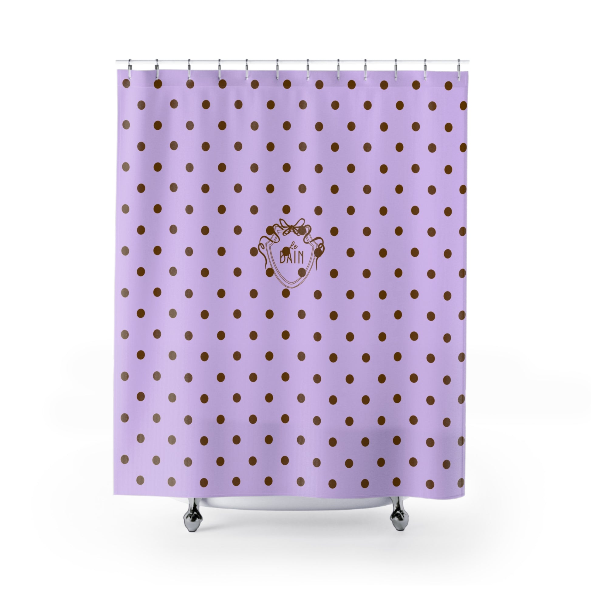 Purple shower curtain with gold polka dots and a logo on a white background