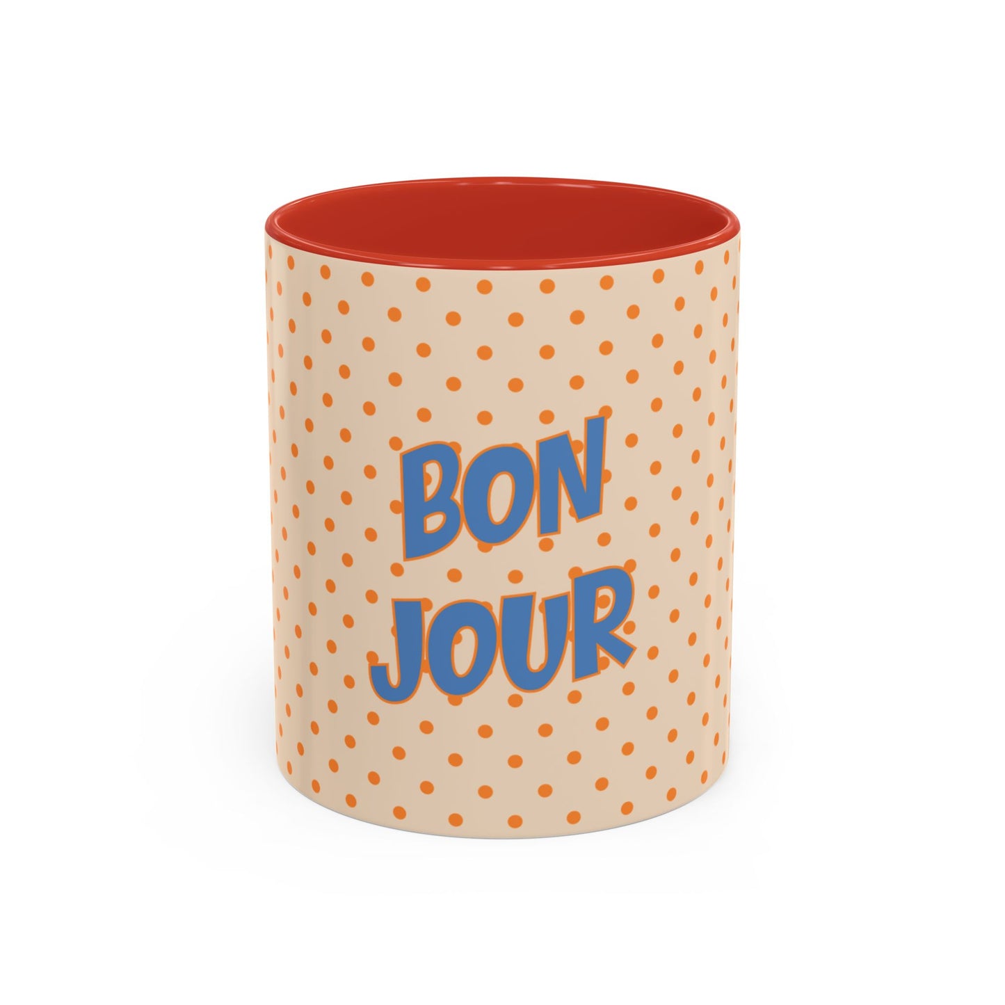Mug with polka dot pattern and 'Bonjour' text on a white background