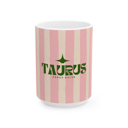 Mug with pink and beige striped pattern and 'Taurus' text on a white background