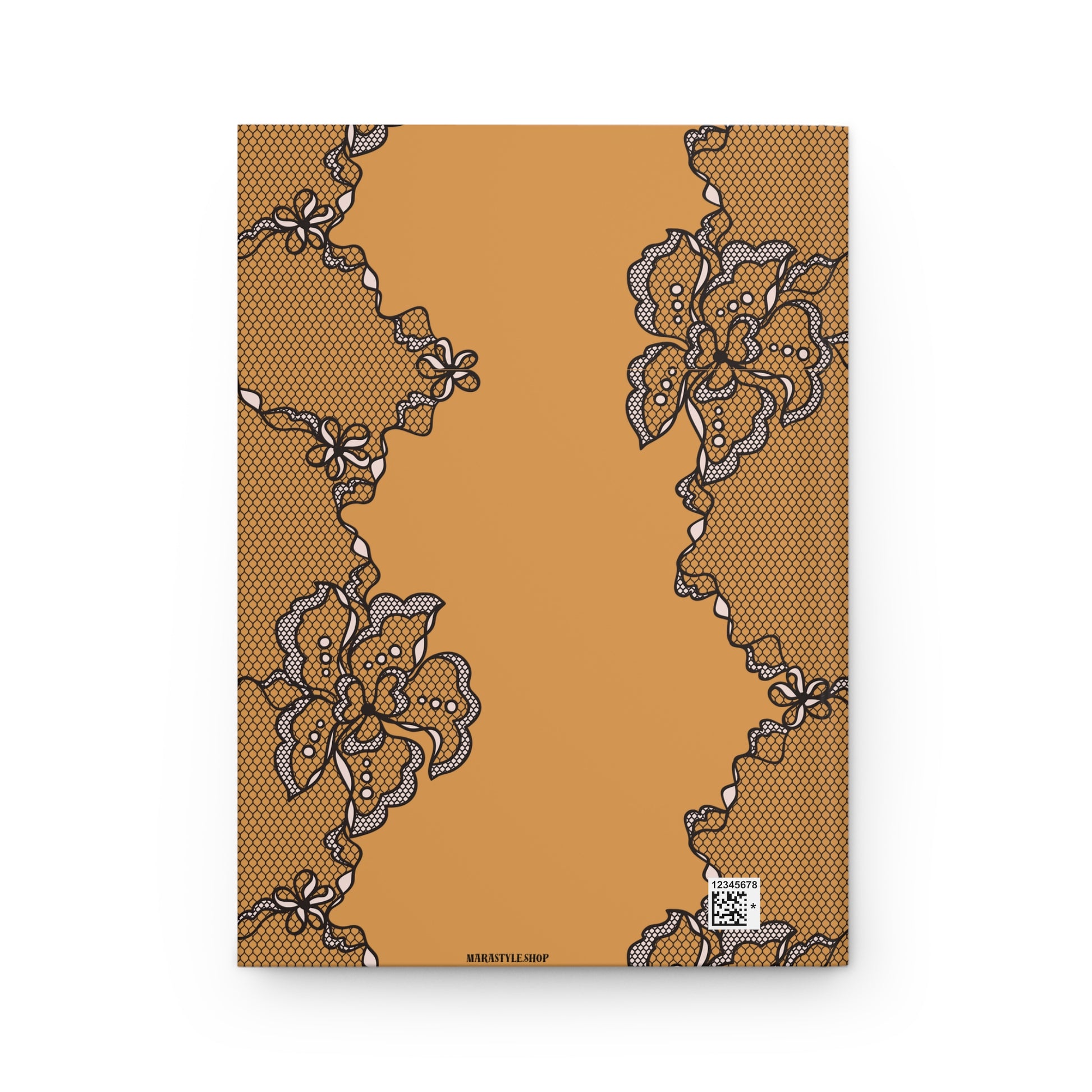 Notebook with black lace design on a brown background