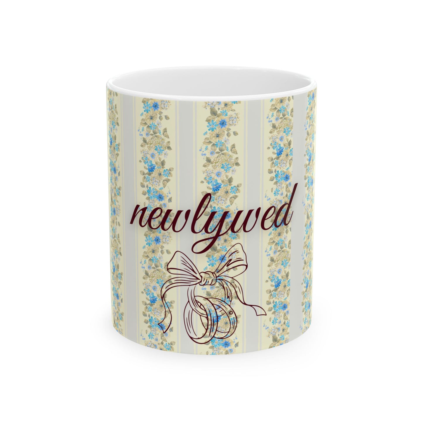 Mug with floral design and 'newlywed' text on a white background
