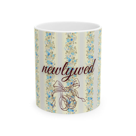 Mug with floral design and 'newlywed' text on a white background