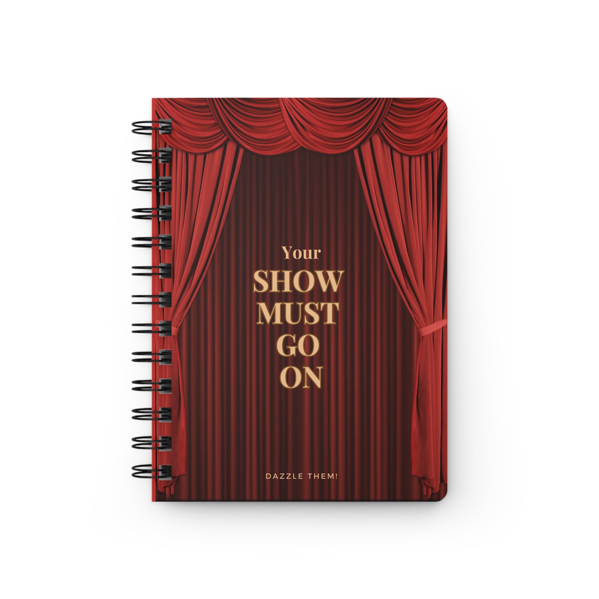 Notebook with red curtain design and 'Your Show Must Go On' text on a white background