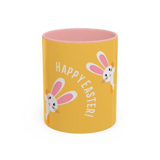 Yellow mug with pink interior, Easter bunny design, and 'Happy Easter!' text on a white background