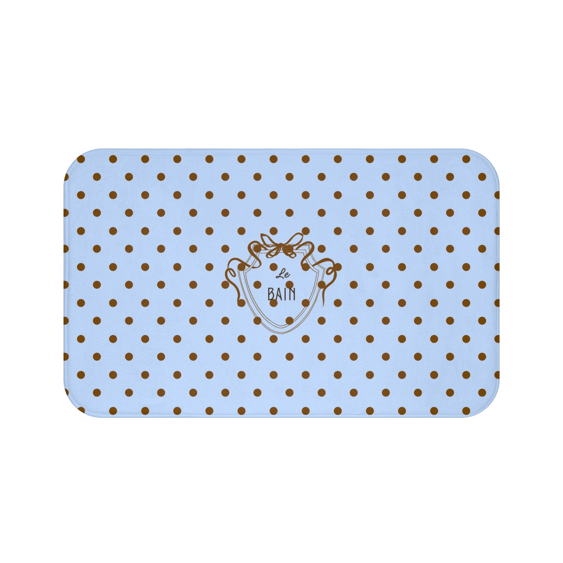 Rectangular blue bath mat with gold polka dots and a logo on a white background