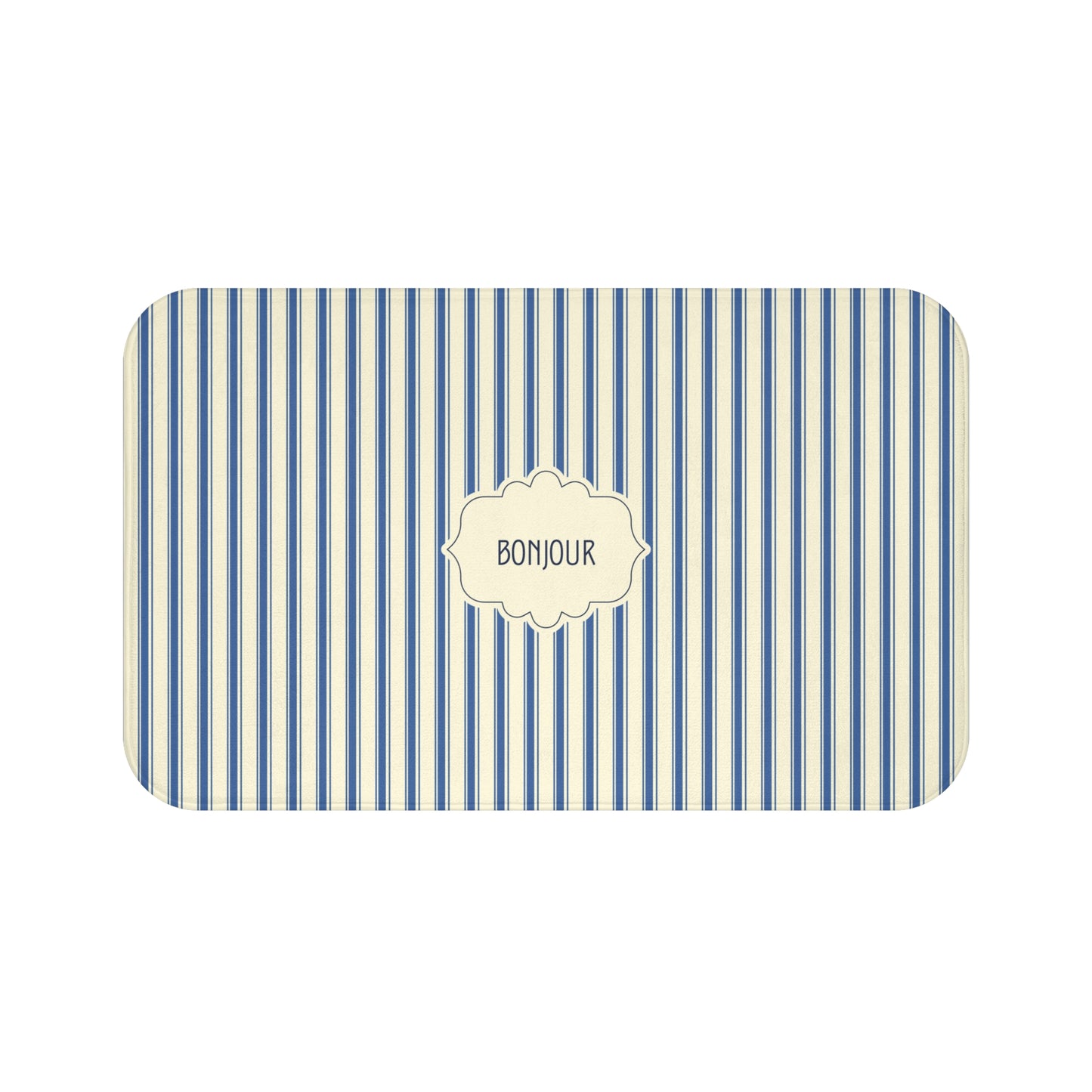 A luxury bath mat with rounded corners, featuring vertical blue and cream stripes and a central cream label with the word 'BONJOUR'.