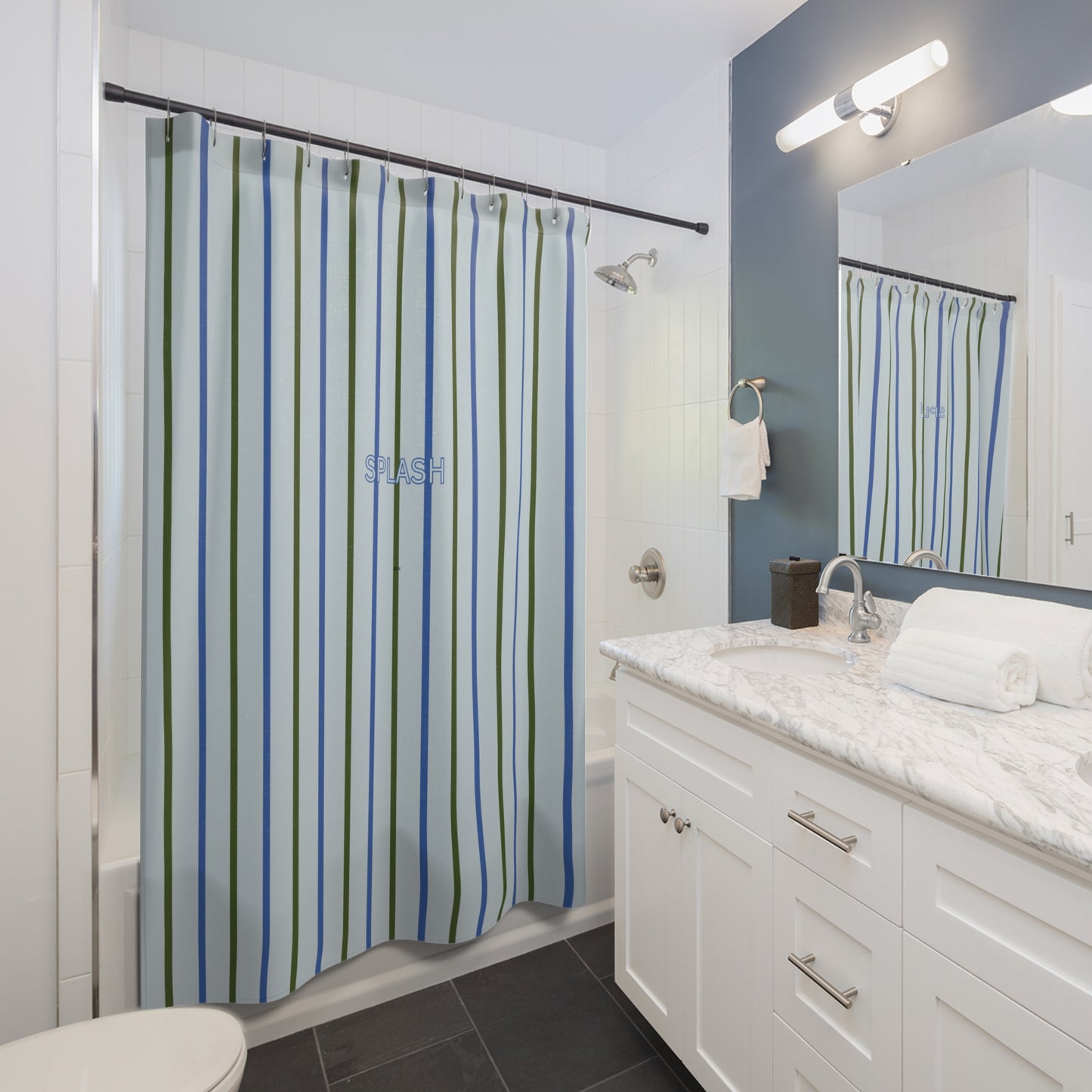 Bathroom with striped shower curtain, sink, and mirror.