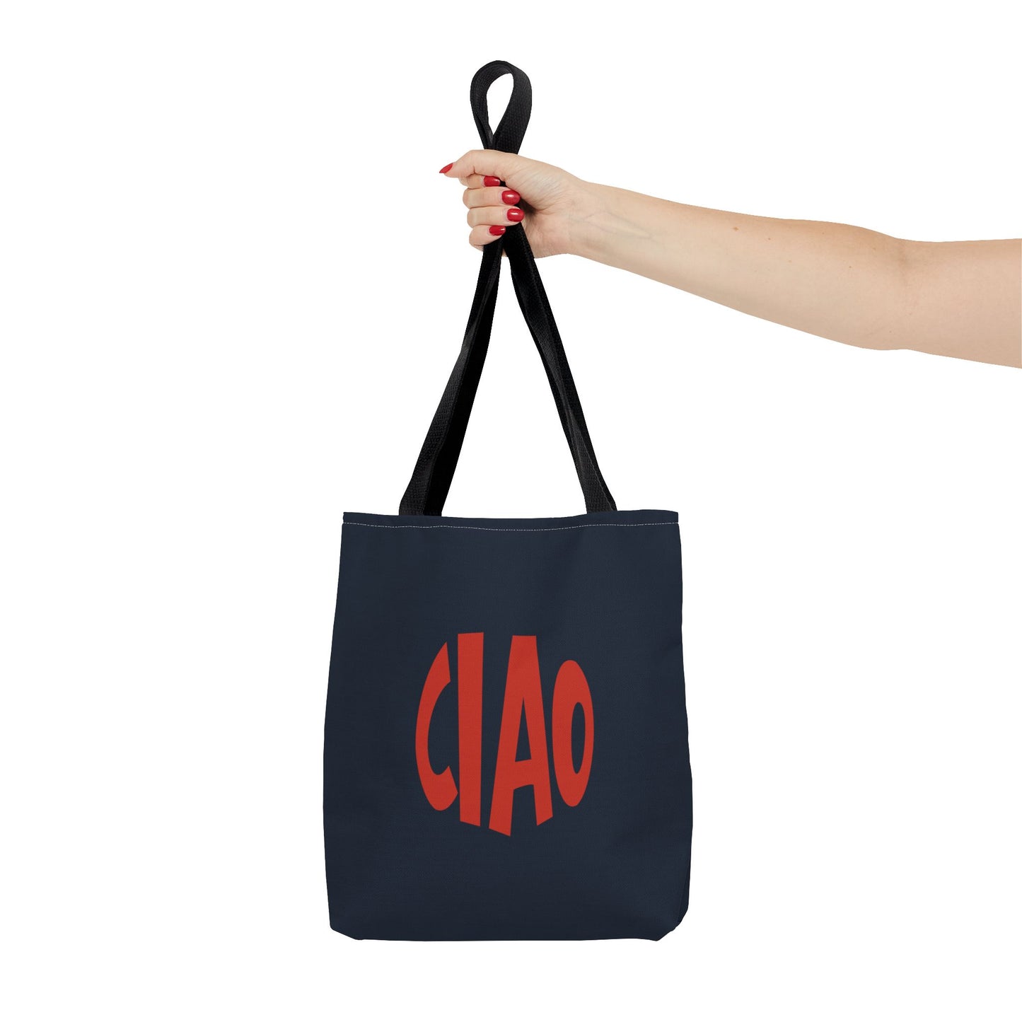 Navy tote bag with 'CIAO' in red text held by a hand on a white background
