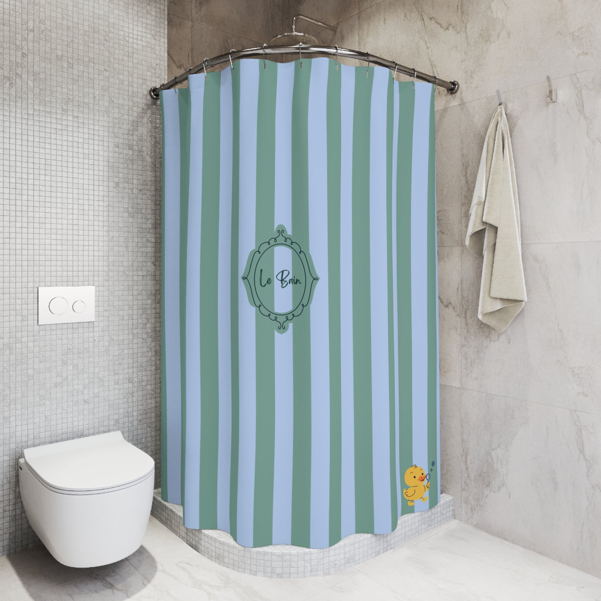 A shower curtain with vertical mint green and light blue stripes, featuring a central decorative frame with the text 'La Bouçe'. The curtain is shown hanging in a modern bathroom with gray tiled walls, a white toilet, and a beige towel.