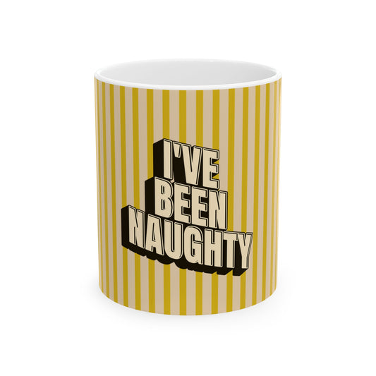 A white ceramic mug with a yellow and beige vertical striped pattern, featuring the text 'I'VE BEEN NAUGHTY' in a bold 3D-style cream and black font on the front.
