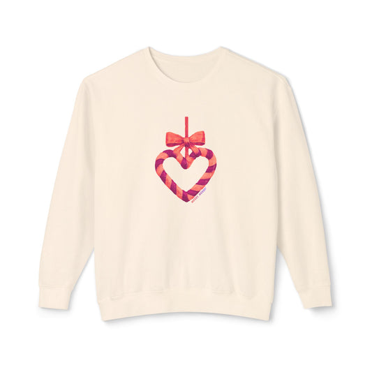 Beige sweater with a holiday heart and bow design