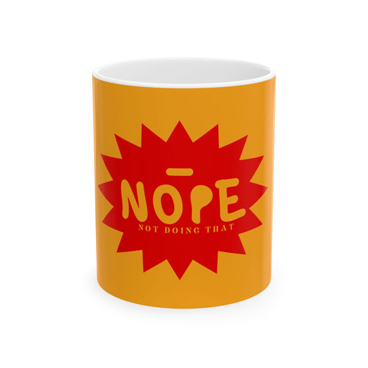 A yellow-orange ceramic mug with a red starburst graphic on the front featuring the word 'NOPE' in yellow and the phrase 'NOT DOING THAT' underneath, shown on a plain white background.