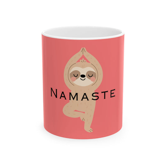 Pink mug with a sloth doing yoga and 'Namaste' text on a white background