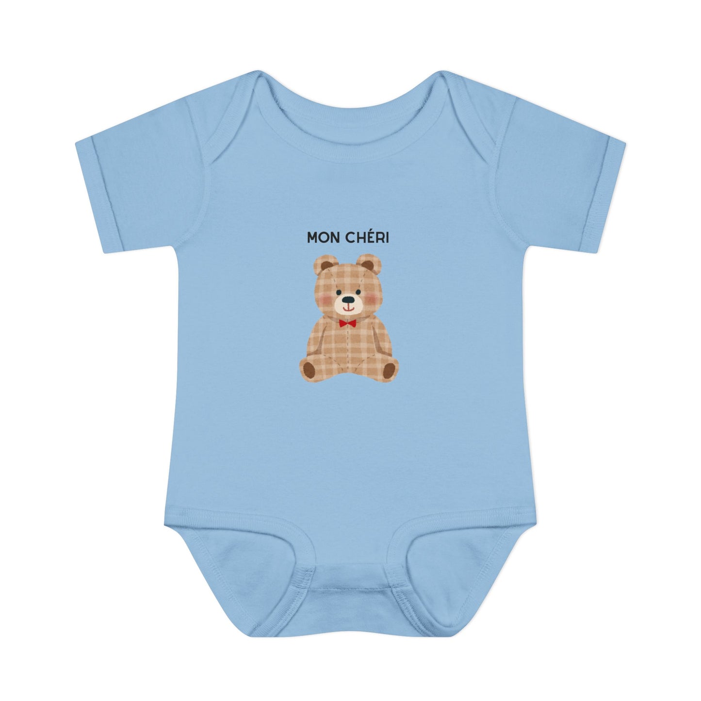 Light blue baby onesie with a teddy bear graphic and 'MON CHÓRI' text on a white background