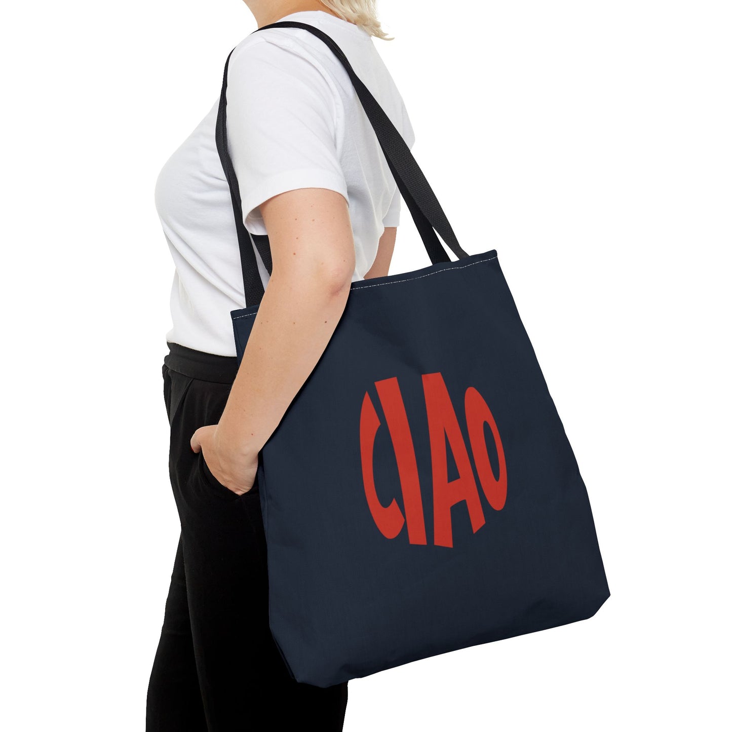 Person holding a navy tote bag with 'CIAO' in red text on a white background