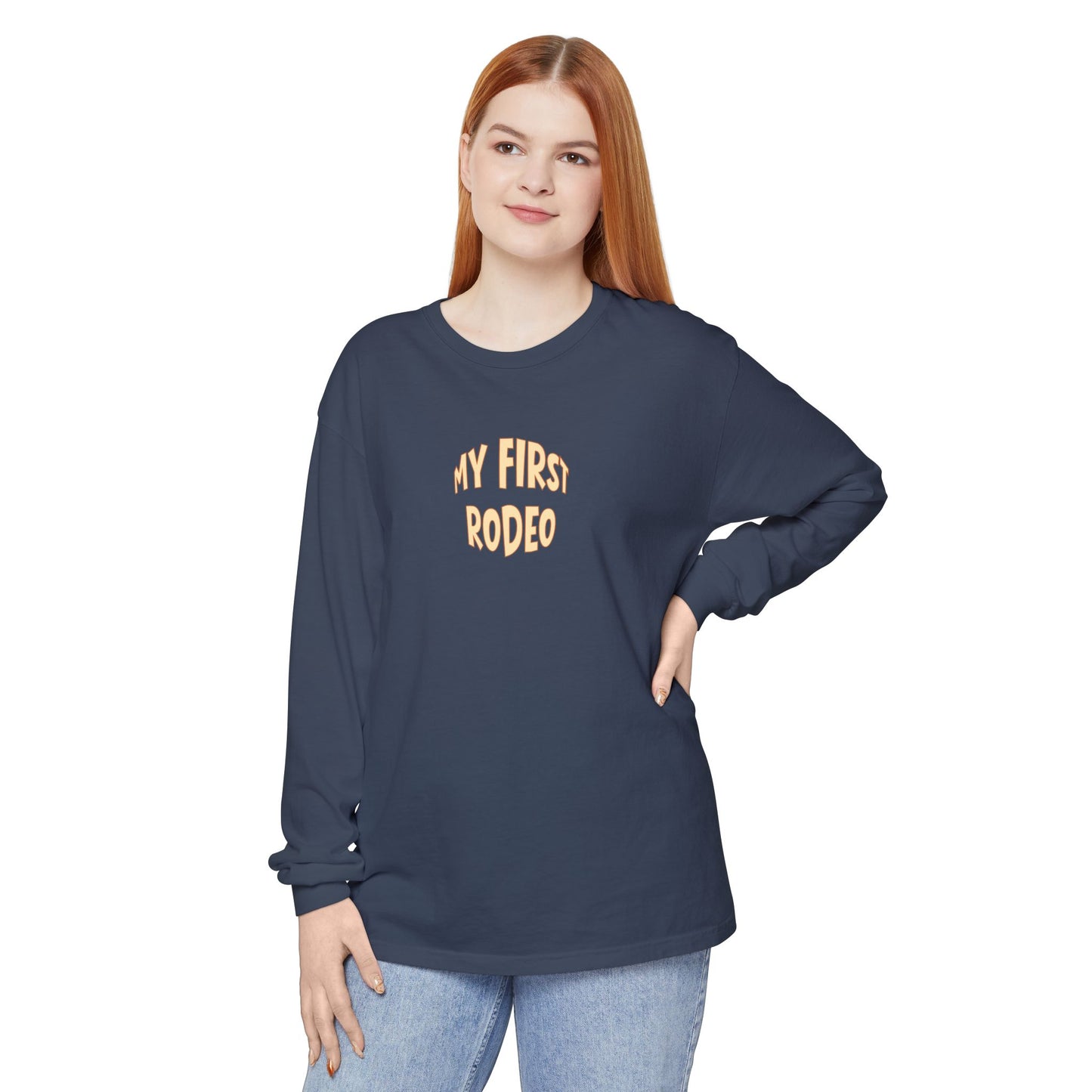 Person wearing a navy blue long-sleeve shirt with 'My First Rodeo' text on a white background
