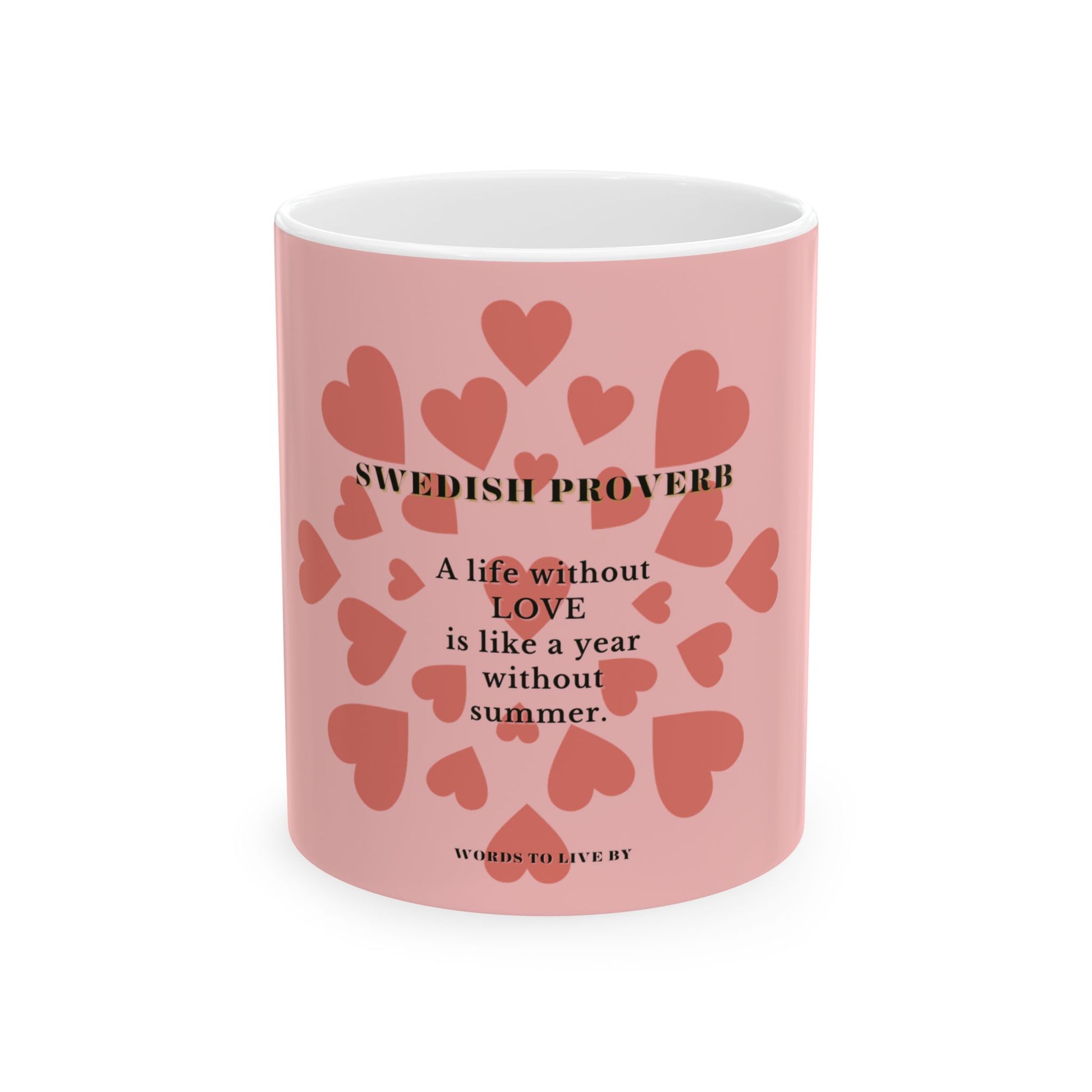 Pink mug with heart designs and a Swedish proverb on a white background