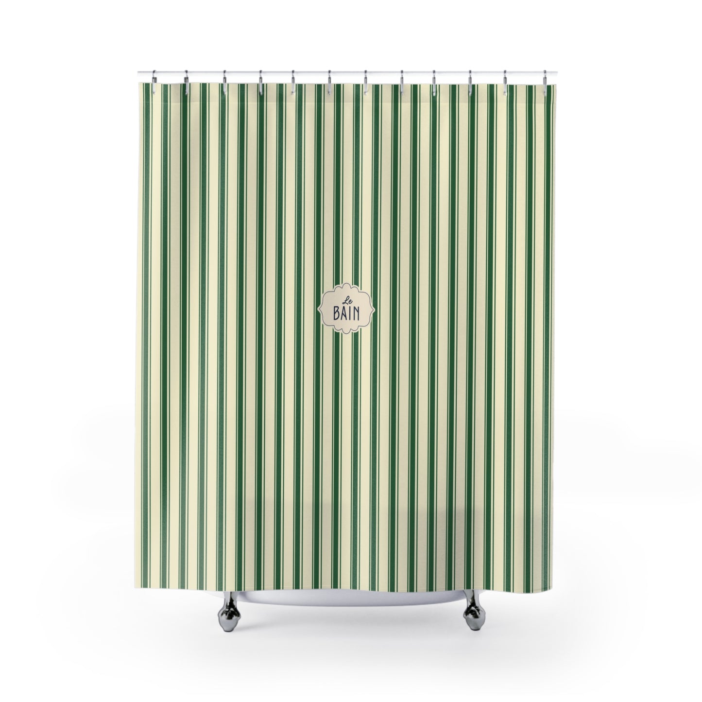 A green and cream striped shower curtain with a central circular 'BATH' logo, hanging from silver hooks on a white background.