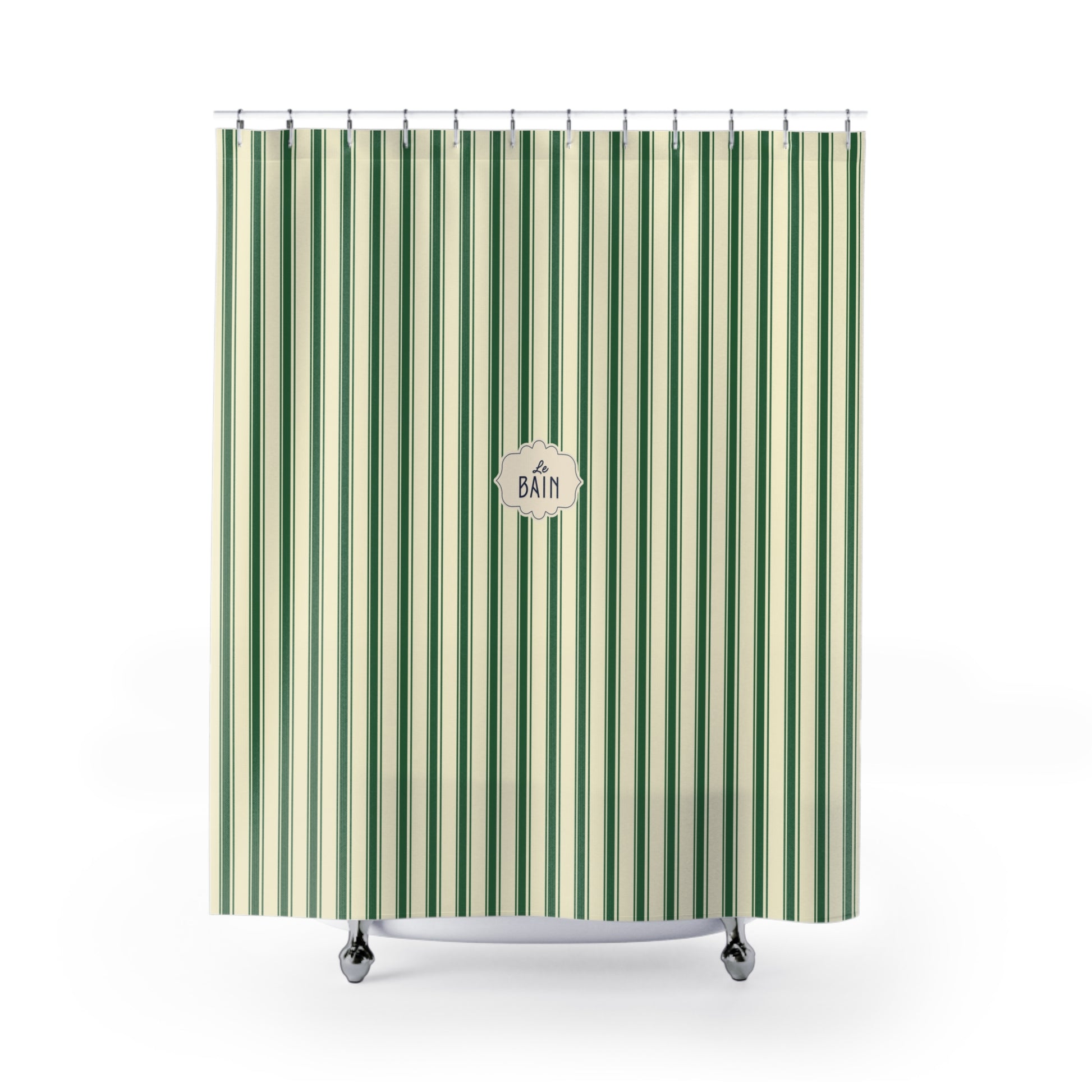 A green and cream striped shower curtain with a central circular 'BATH' logo, hanging from silver hooks on a white background.