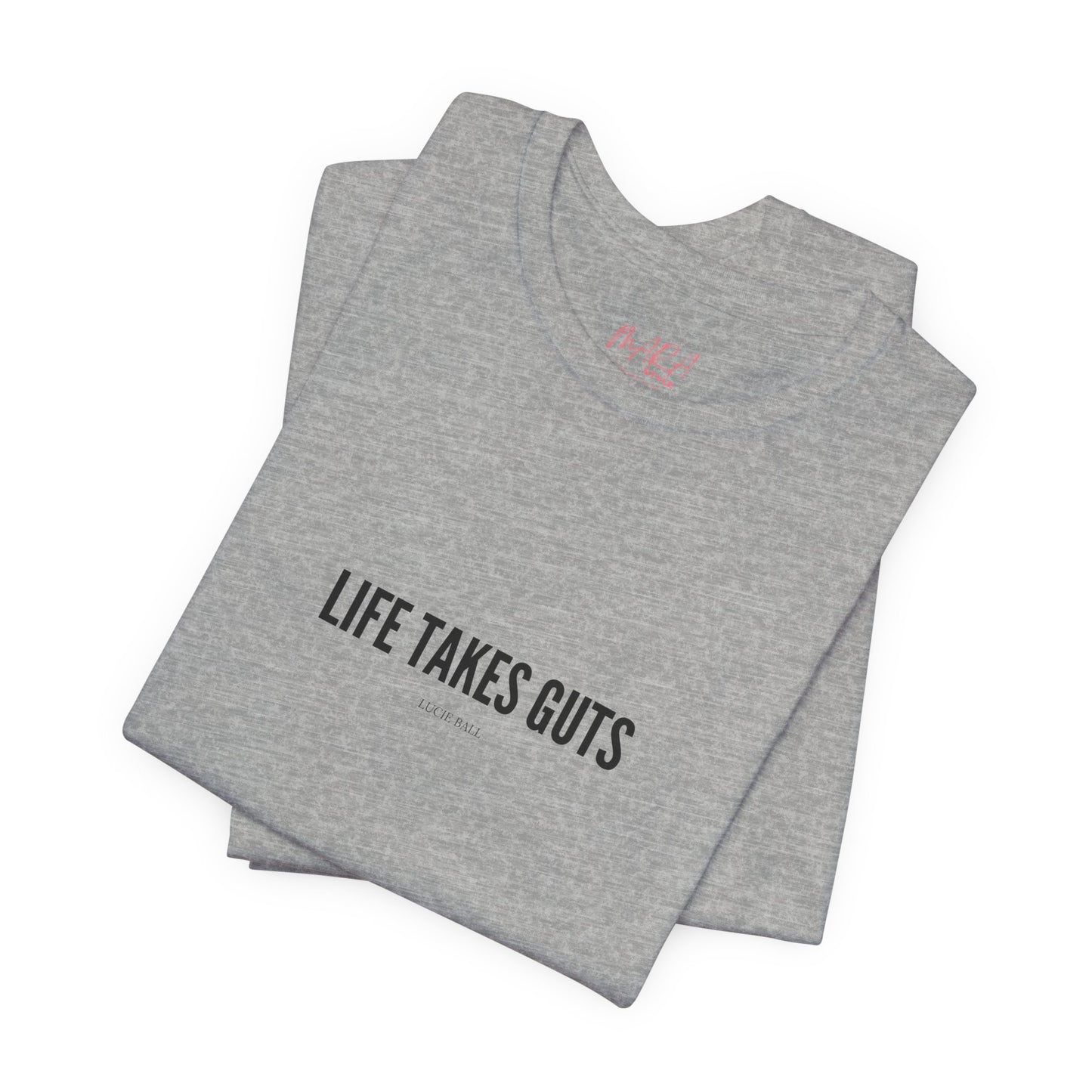 Folded gray t-shirt with 'Life Takes Guts' text on a white background