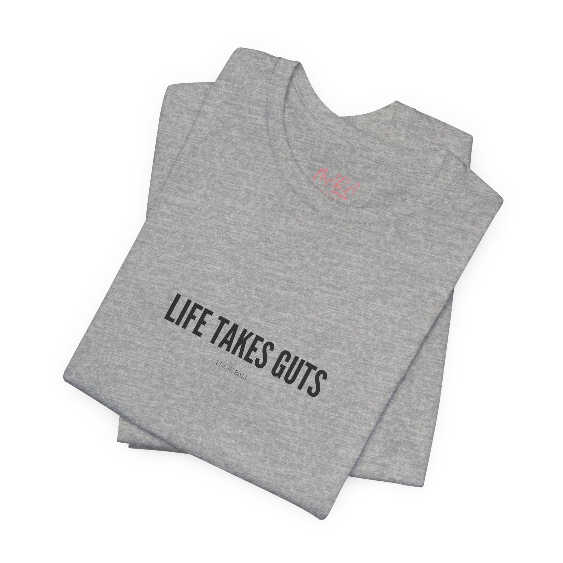 Folded gray t-shirt with 'Life Takes Guts' text on a white background