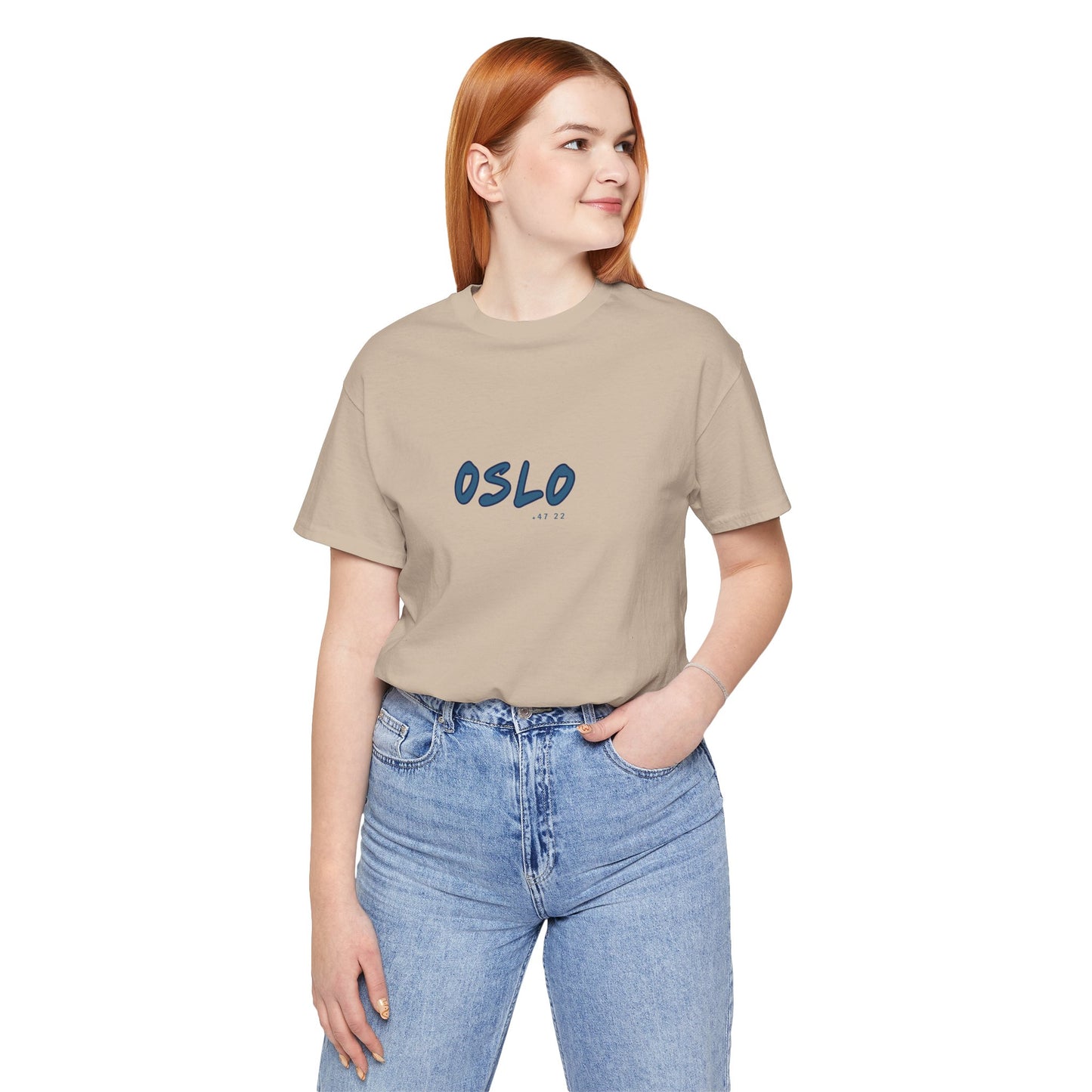 Person wearing a beige t-shirt with 'OSLO' printed on it against a white background