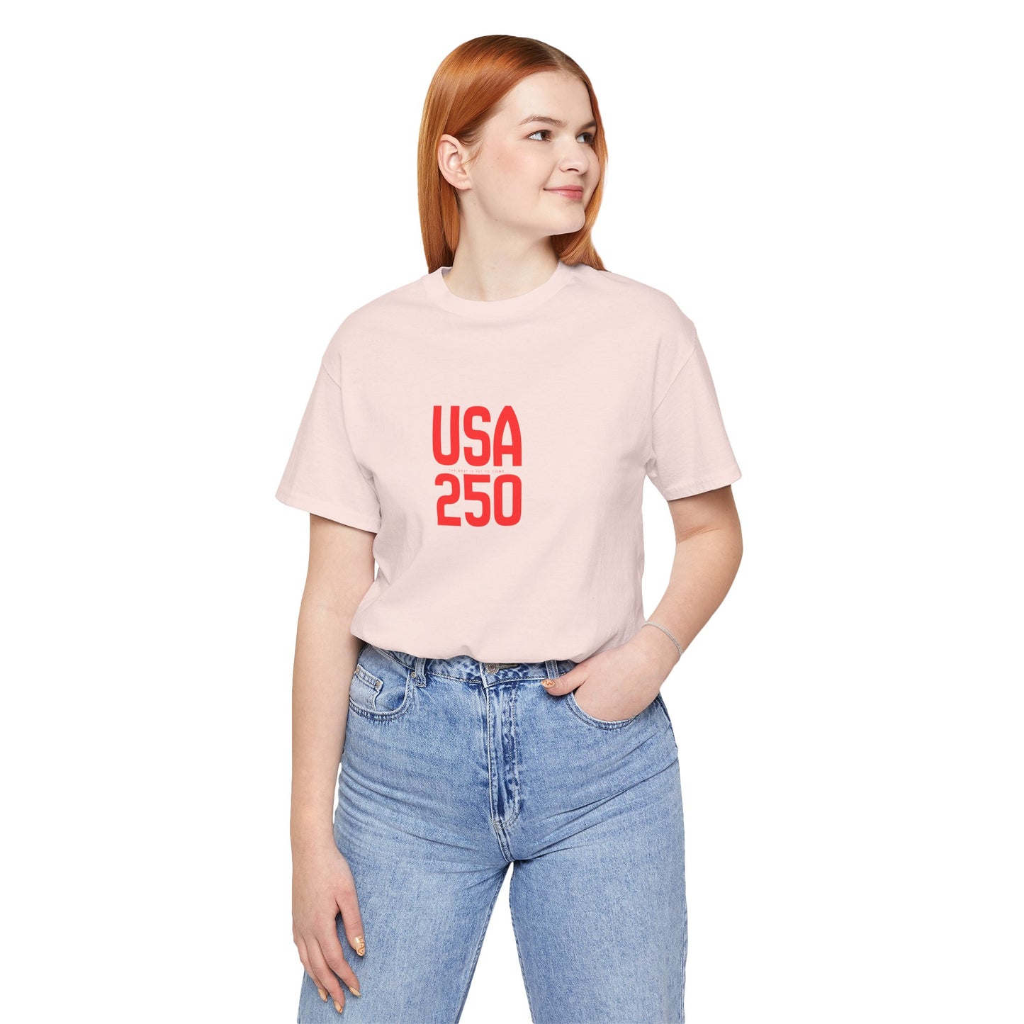 Person wearing a light pink t-shirt with 'USA 250' text on a white background