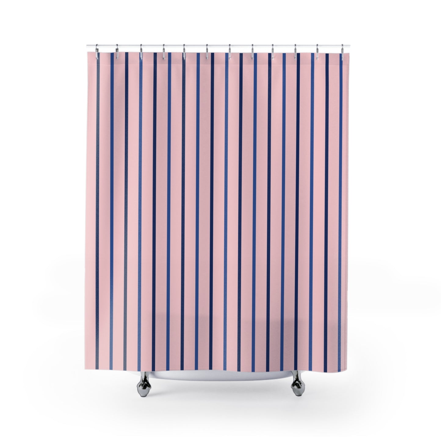 Pink shower curtain with vertical navy and purple stripes, hanging from silver rings on a white background.