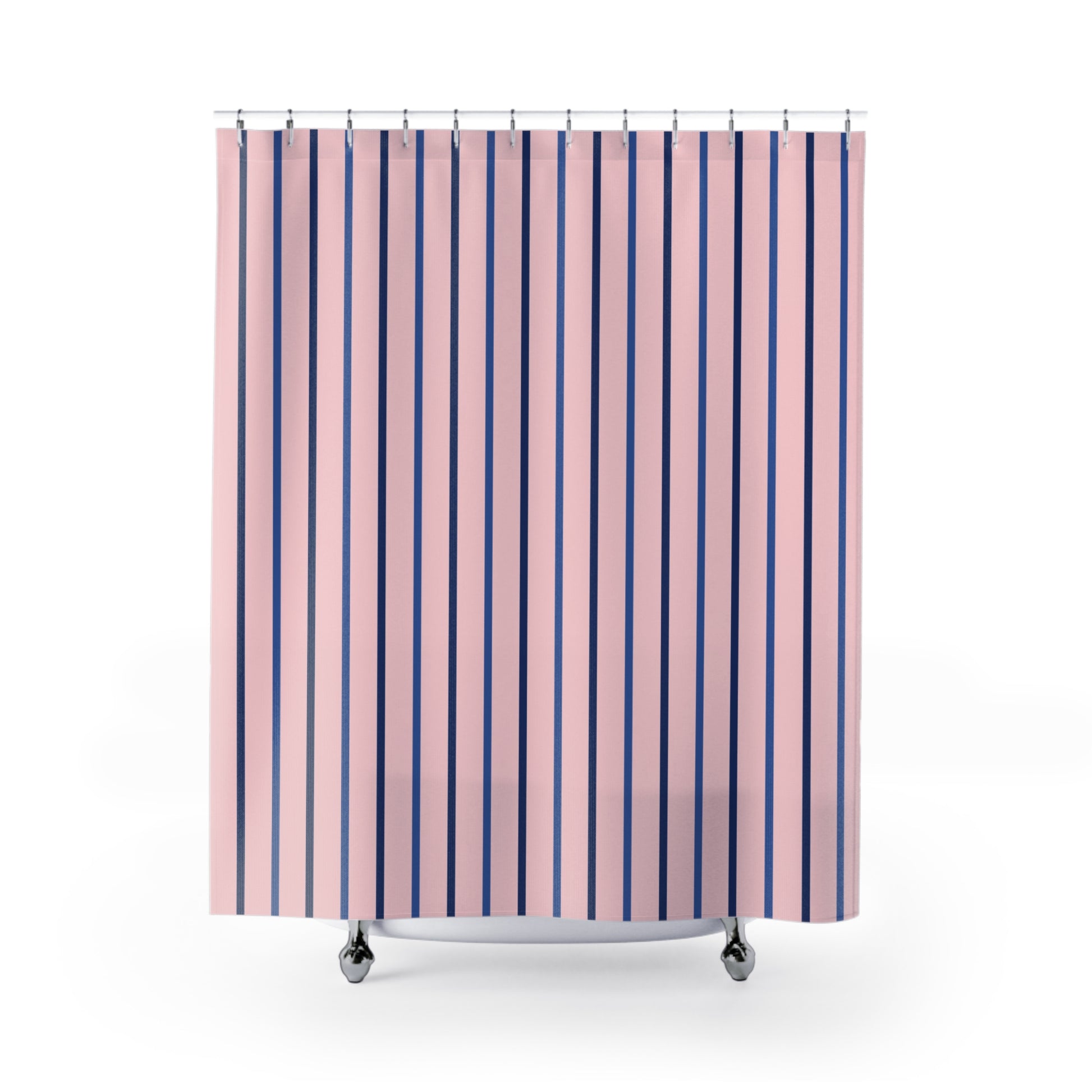Pink shower curtain with vertical navy and purple stripes, hanging from silver rings on a white background.