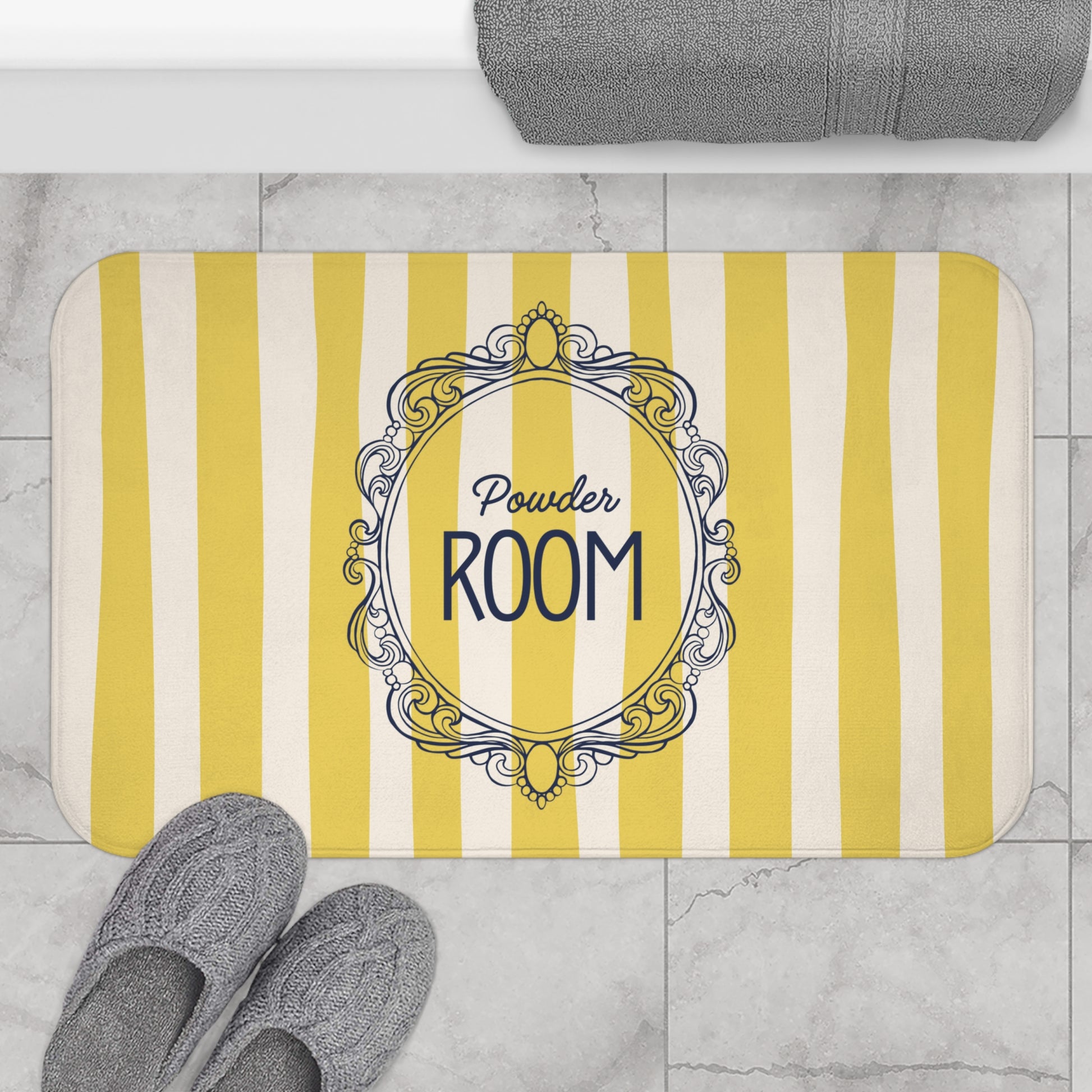 Striped doormat with 'Powder Room' text on a tiled floor.