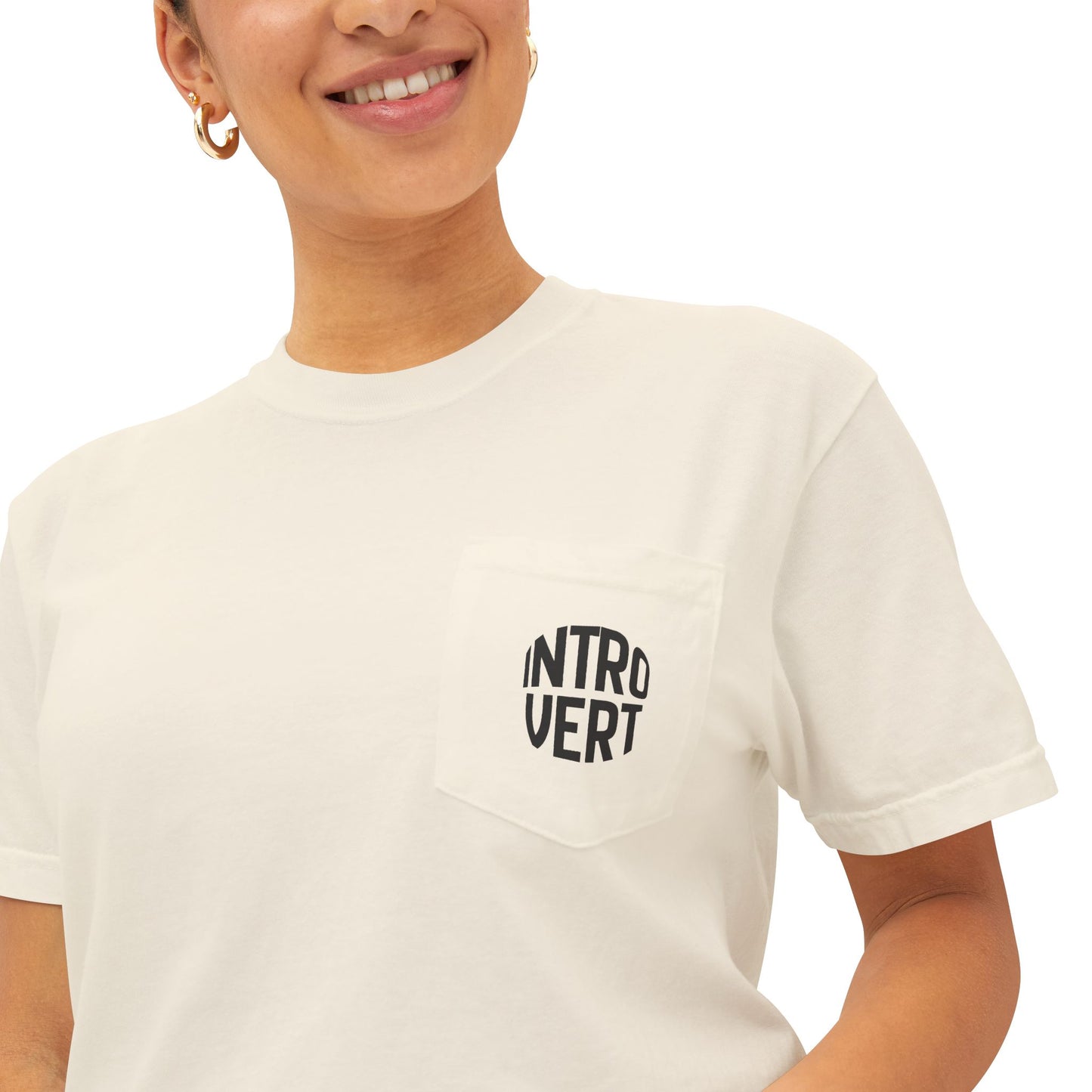 Person wearing a white t-shirt with 'INTROVERT' text on a plain background