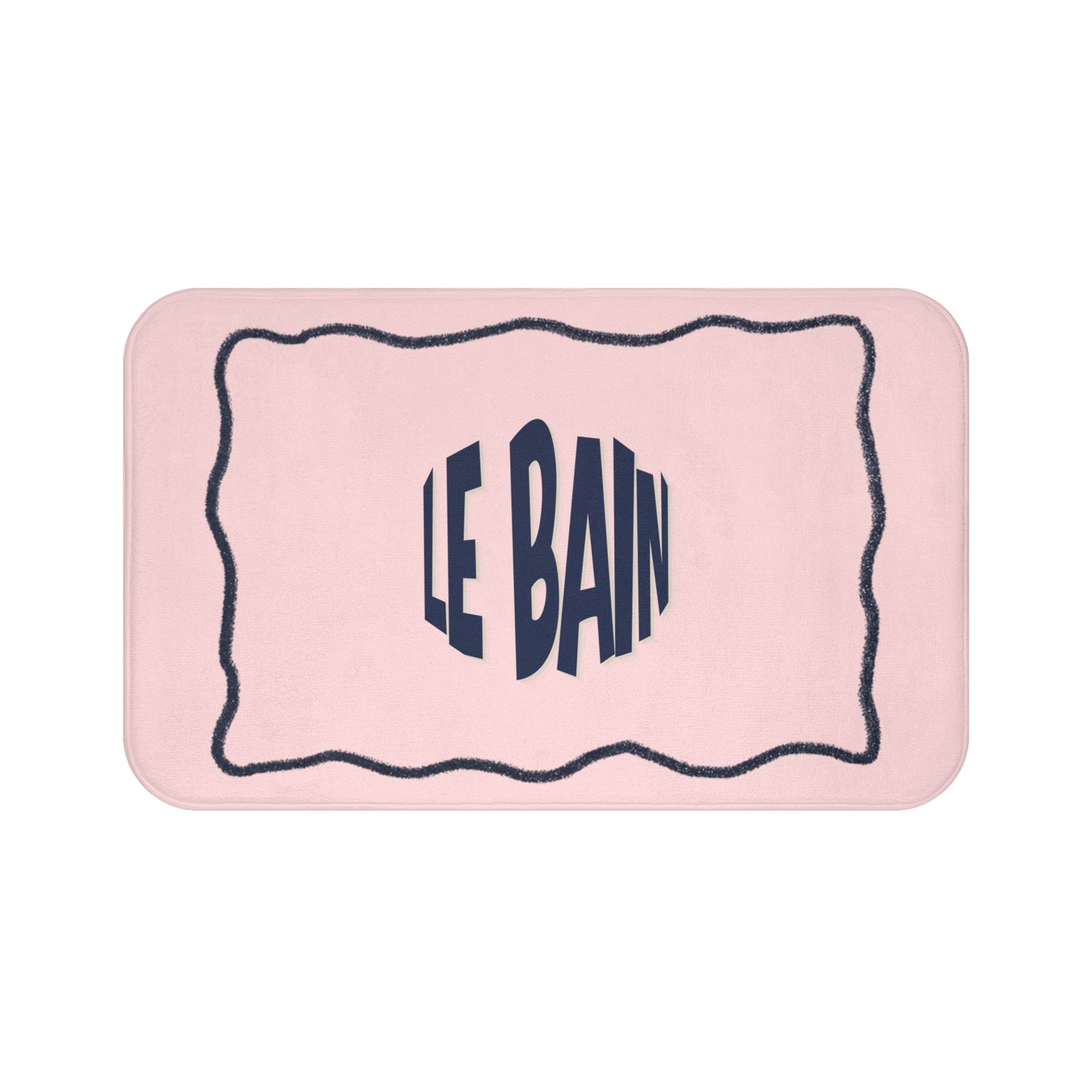 Pink bath mat with 'LE BAIN' text on a white background