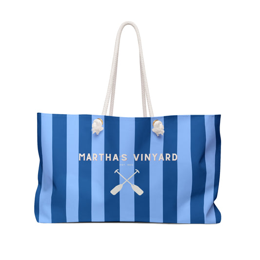 Blue and white striped bag with 'Martha's Vineyard' text and oar design on a white background