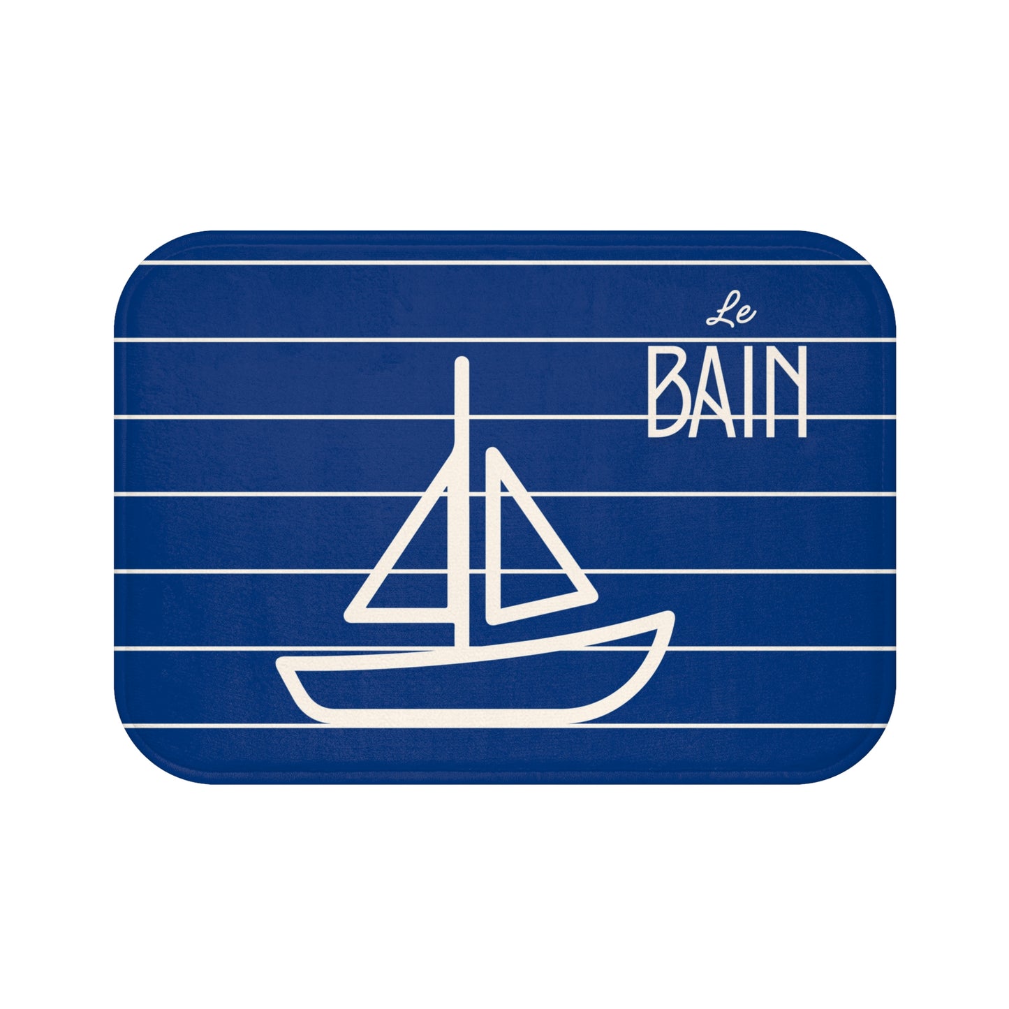Blue bathroom rug with white sailboat illustration and 'Le Bain' text on a white background