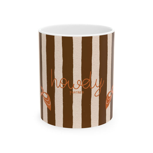 Striped mug with 'howdy partner' text on a white background